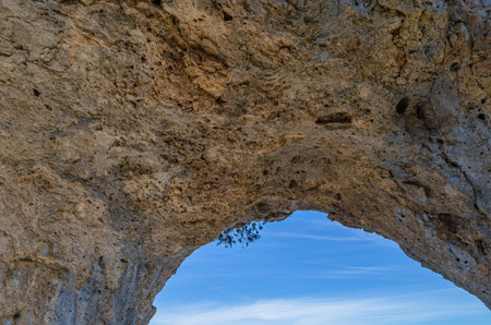 Devil's Window (Spanish: Ventano del Diablo), an example of karst erosion on limestone rock in the Serrania de Cuenca Natural Park, Castilla la Mancha, Spainの写真素材