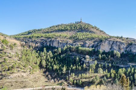 Landscape near the city of Cuenca, Castilla La Mancha, Spain. In the distance, the Monument to the Sacred Heart of Jesus can be seen, a statue built in honor of Jesus of Nazareth atop Socorro Hillの写真素材