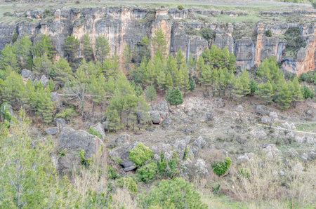 Landscape in the Jucar Gorge, near the town of Cuenca, Spain, a natural phenomenon caused by the erosion of the waters of this river on the limestone rockの写真素材