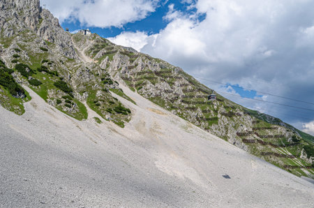 INNSBRUCK, AUSTRIA - JULY 11, 2015: Gondola from Seegrube to Hafelekar Station, part of the Nordkette Cable Car (Nordkettenbahn) in the Austrian state of Tyrol, is a gondola lift from Innsbruck to the Nordkette, the southernmost mountain chain of the Karwのeditorial素材