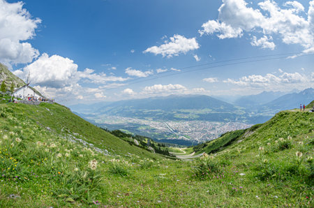 INNSBRUCK, AUSTRIA - JULY 11, 2015: Aerial view of the city of Innsbruck, Austria, with the Seegrube restaurant, located 1900m above sea level at the Nordkette Cable Car Seegrube stationのeditorial素材
