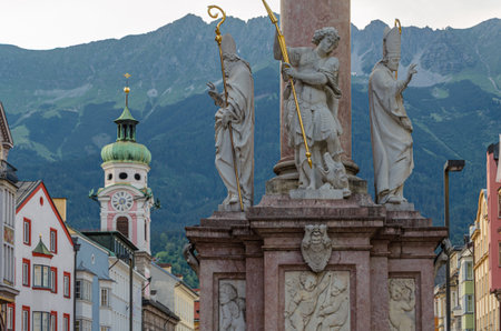 Statues of saints on the base of St. Anne's Column (Annasaule) in the old town of Innsbruck, Tyrol, Austriaの写真素材