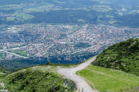 View of the city of Innsbruck, Austria from Seegrube station on Nordkette, the southernmost mountain chain of the Karwendel in the Austrian Alpsの写真素材