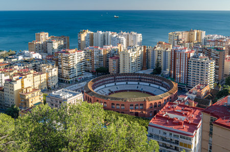 MALAGA, SPAIN - JANUARY 26, 2020: Aerial view of Malaga, Spain, from Mount Gibralfaro. View of La Malagueta, a central coastal district, with the Plaza de Toros (bullring), a Neo-Mudejar building, in the foregroundのeditorial素材