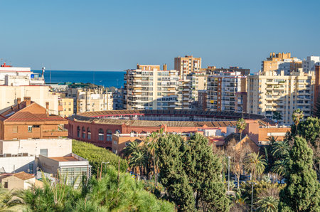 MALAGA, SPAIN - JANUARY 26, 2020: Aerial view of Malaga, Spain, from Mount Gibralfaro. View of La Malagueta, a central coastal district, with the Plaza de Toros (bullring), a Neo-Mudejar building, in the foregroundのeditorial素材