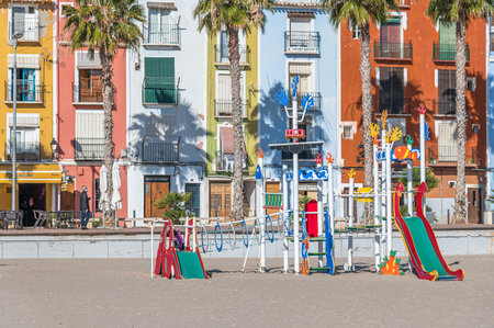 VILLAJOYOSA (LA VILA JOIOSA), SPAIN - JANUARY 20, 2023: Children's play area located on the beach of Villajoyosa, Valencian Community, Spainのeditorial素材