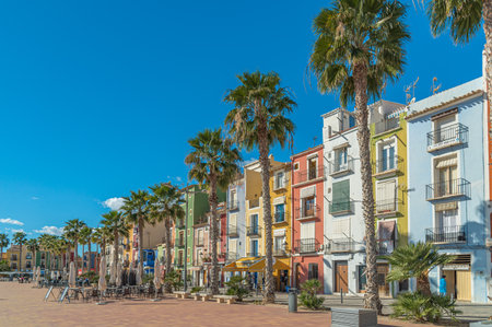VILLAJOYOSA (LA VILA JOIOSA), SPAIN - JANUARY 20, 2023: Restaurant terrace on the beachfront in Villajoyosa, Alicante province, Valencian Community, Spainのeditorial素材