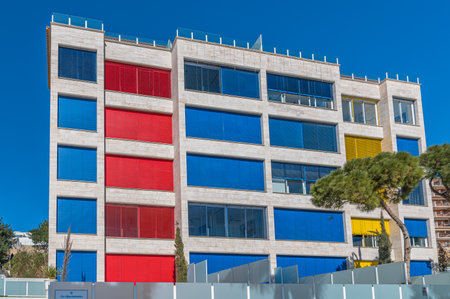VILLAJOYOSA (LA VILA JOIOSA), SPAIN - JANUARY 20, 2023: Modern beachfront apartments in Villajoyosa, Valencian Community, Spain, with a colorful facade in keeping with the city's colorful buildingsのeditorial素材