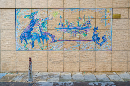 LOGRONO, SPAIN â APRIL 26, 2015: Street art mural on Juan Lobo street in Logrono, La Rioja, Spain; beside an information plaque describing Juan Lobo as an apothecary and alchemist; the plaque's legend says the sorcerer Johanes turned him into a catのeditorial素材