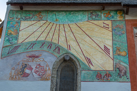 SALZBURG, AUSTRIA - JULY 5, 2015: Mural wall sundial on the south facade of St. George Chapel inside...