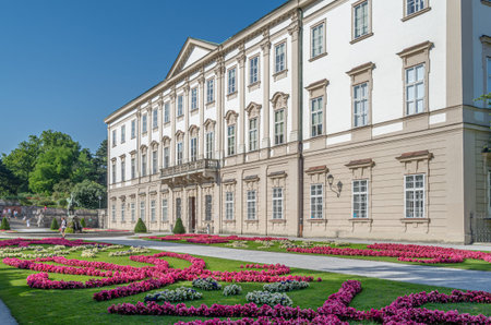 SALZBURG, AUSTRIA - JULY 5, 2015: People strolling through the Mirabell Palace and Mirabell Gardens...
