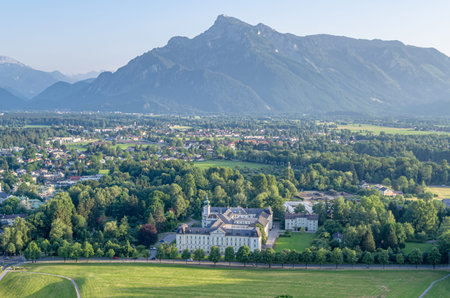 View from Hohensalzburg Fortress of a historic chapel with onion dome, residential buildings and...