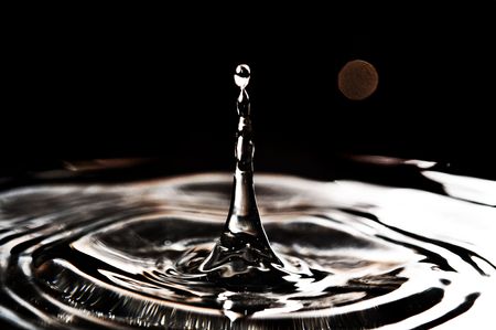 Beautiful splash of water, black backgroundの写真素材