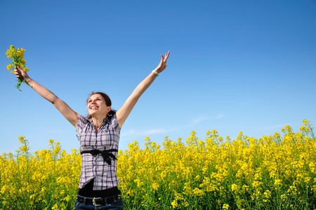 Girl in a yellow field, freedomの写真素材