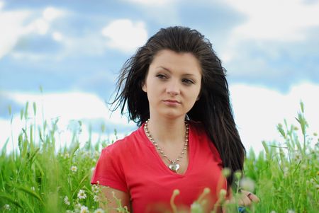 Beautiful girl in a fieldの写真素材