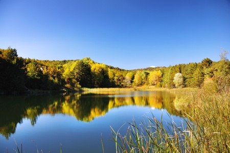 Lake on the top of the autumn mountainの写真素材