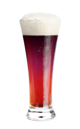 Glass with beer isolated on whiteの写真素材