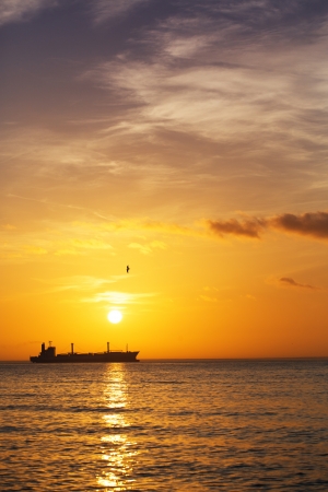 Beautiful sunrise over the horizon, dramatic cloudsの写真素材