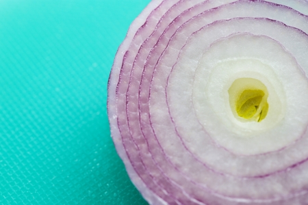 Red Onion Portion isolated on green backgroundの写真素材