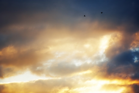 Stormy cloudy sky, sunset shotの写真素材