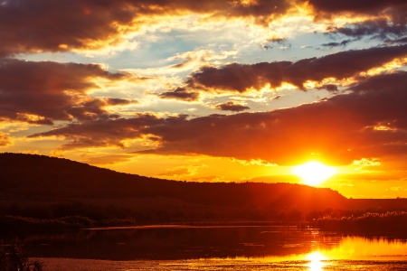 Dramatic sunset over the lakeの写真素材