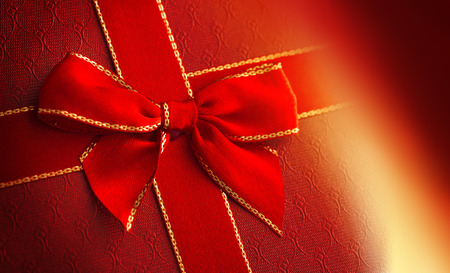 Red gift box with red ribbon , close upの写真素材