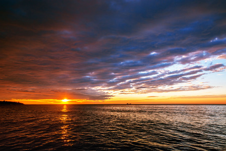 Orange cloudscape and dramatic blue sky, sunrise shot の写真素材