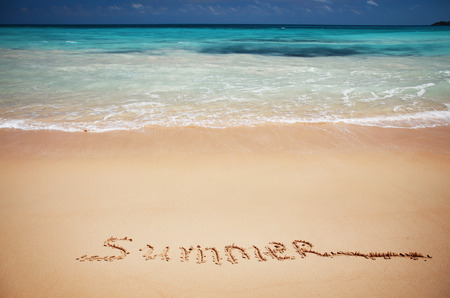 Inscription summer on sea sand の写真素材