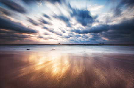 Dramatic cloudscape over the sea, sunrise shotの写真素材
