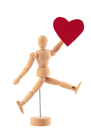 Wooden man toy statue and heart isolated on white background. Valentineâs day concept.の写真素材