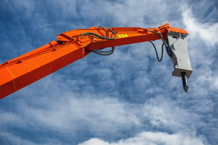 Backhoe loader or bulldozer - excavator and blue sky