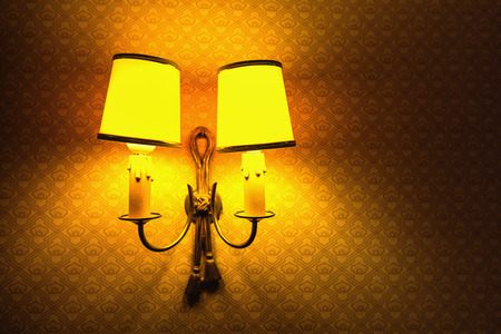 Retro styled lamp on the wall of the hotel room
