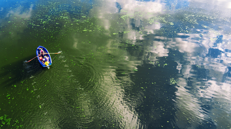 Aerial view of a wooden boat in the lakeの写真素材