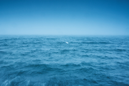 Fog over the ocean waves, natural backgroundの写真素材