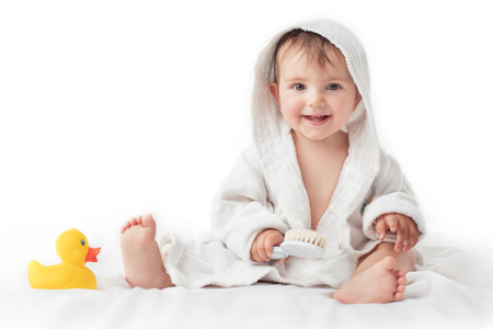 Little baby smiling under a white towelの写真素材