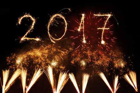 2017 Happy New Year written with Sparkle firework on black background,の写真素材