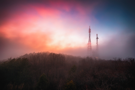 Connection and radio tower in the top of the mountainの写真素材