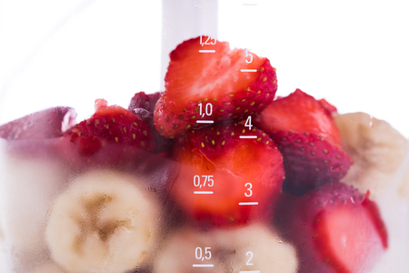 Electric Blender with different fruits for smoothie isolatedの写真素材