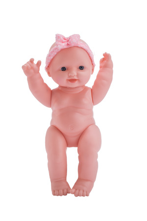 Cute little plastic baby doll with blue eyes sitting  on empty background の写真素材