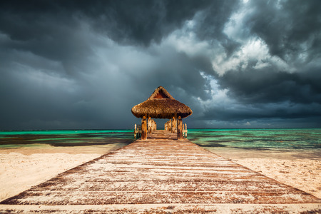 Dramatic clouds over the  Wooden Water Villa  in Cap Cana, Dominican Republic.の写真素材