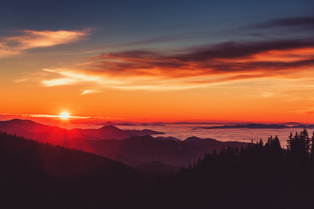 Aerial view of Sunrise over mountain and fogの写真素材
