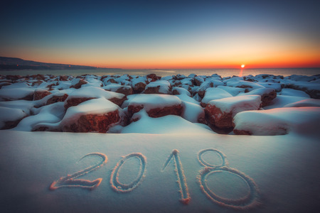 New Year 2018. Written 2018 on the snow beach. Concept of New Year.