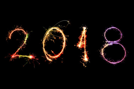 2018 Happy New Year written with Sparkle firework on black background,