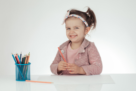 Montessori concept.Cute little girl learn to draw.の写真素材