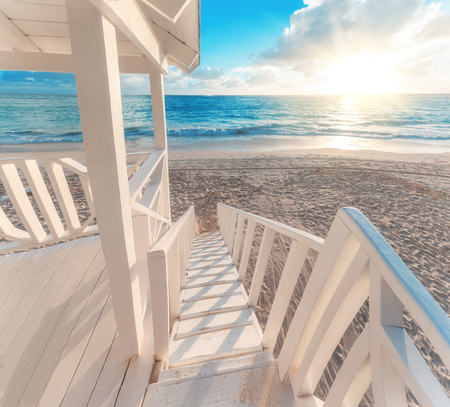 Punta Cana sunrise over Caribbean beach in  with lifeguard station.の写真素材