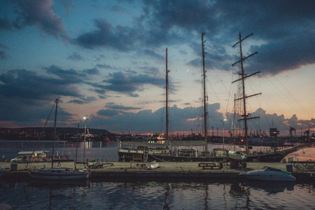 Yacht port and beautiful sunset over Varna, Bulgaria. Sailboat harbor, many beautiful moored sail...