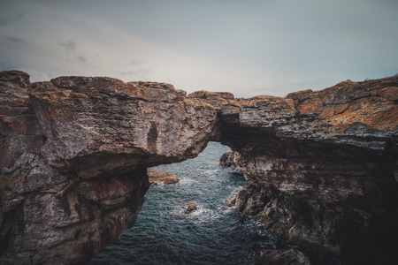 The rock formation Arch in the sea near Tyulenovo, Bulgaria, Europeの写真素材