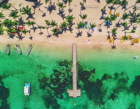 Island sandy beach in Caribbean resort, Bavaro, Dominican Republic. Summer vacation. Aerial drone...