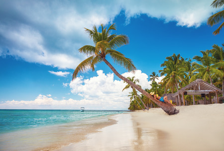 Free happy woman enjoying tropical Caribbean island Saona, Dominican Republic. Summer vacation and healthy living concept.の写真素材