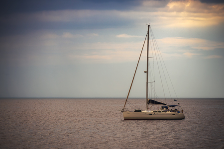 Sailing Regatta in the wind through the waves at the sea.の写真素材